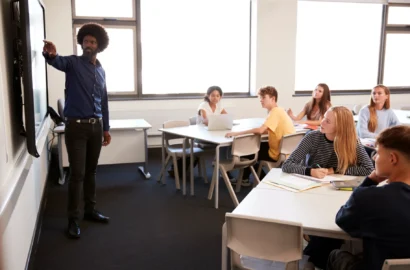 male-high-school-teacher-standing-next-to-interact-2024-10-19-01-59-21-utc male-high-school-teacher-standing-next-to-interact-2024-10-19-01-59-21-utc